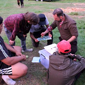 Matt Dale dissecting a trout and showing tauira.