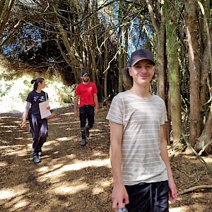 Sentre Harden enthusiastically walking through Tōtara Forest.