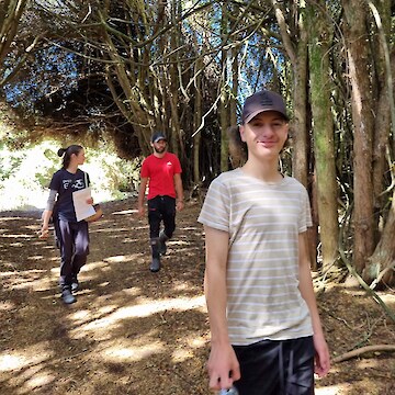 Sentre Harden enthusiastically walking through Tōtara Forest.