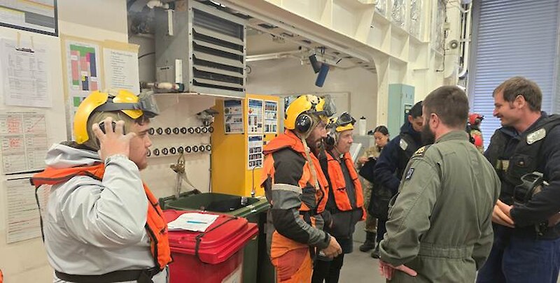 Ali Harrison, Vincient Leith and Tony Leith prepare to deploy via NZDF Sea Sprite helicopter for remote field access. Photo by Hokonui Rūnanga.