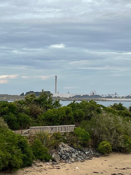 View of the New Zealand Aluminium Smelter from the Bluff coastal walkway.